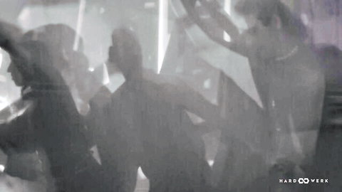 Paulita Pappel in shadowy club group scene from HARDWERK 2Bang