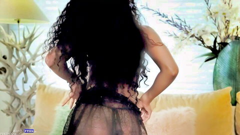 Aliya Aural curly-haired ebony beauty teasing in sheer black lingerie striptease