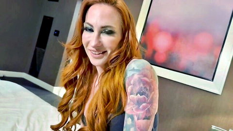 Sophia Locke as hot redhead stepmom smiling seductively with tattoos and cleavage