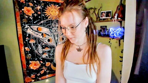 Cute freckled redhead teen in glasses teases cleavage in tight white tank top webcam