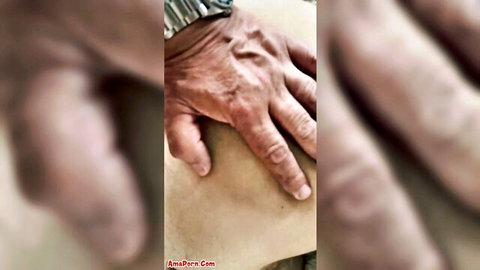 Wrinkled old man hand gripping plump bare female ass cheek closeup amateur