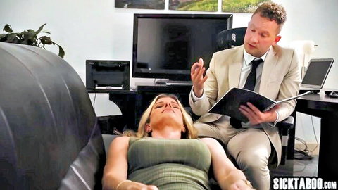 Therapist hypnotizing busty blonde MILF patient on office couch with deep cleavage