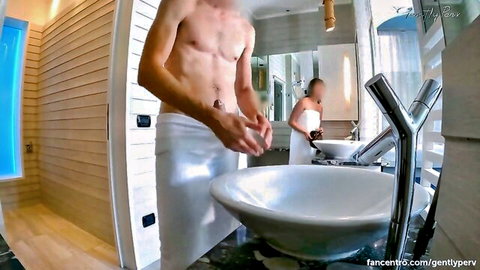 Fit couple in white towels teasing in spa bathroom before risky handjob