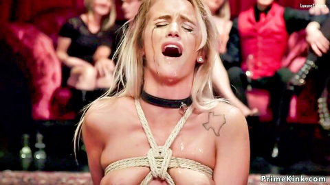 Blonde petite slave bound in ropes and collar, ecstatic in BDSM scene
