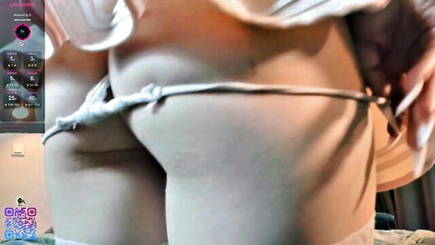 Silkencrave's small round butt exposed under white skirt, panties aside