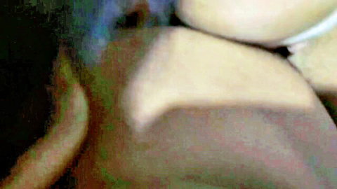 Close-up of big natural pale tits exposed in blurry intimate shot