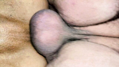 Close-up of mature man's exposed testicles and pubic hair, model SjAtA94