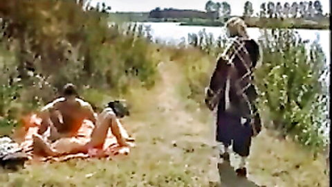 Nude couple outdoor cowgirl sex by river, blonde riding man on blanket