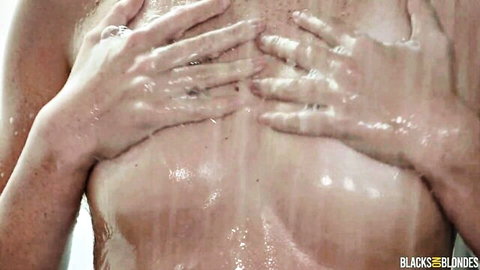 Blonde Stella Luxx wet shower tease hands on big tits