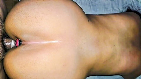 Closeup of big white ass with pink anal plug inserted in hairy stretched asshole
