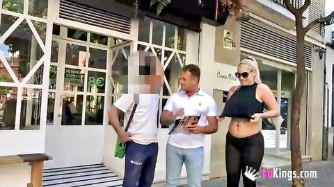 Curvy blonde flashing massive underboob to two men on public street outdoors