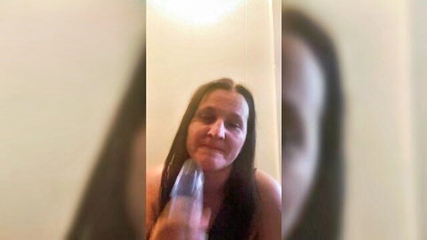 Brunette sucking large blue dildo in solo amateur video thumbnail
