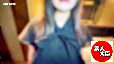 Blurry Japanese mature woman in tight blue dress teasing her big tits