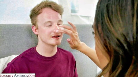 Hot MILF seductively touching young man's face intimately