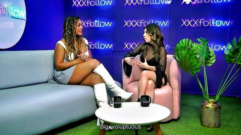 Sexy ebony and brunette babes in sheer top and mini skirt teasing on XXX studio set