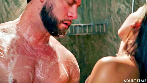 Bearded muscular stud and curvy wet woman intimately soaping bodies in steamy shower