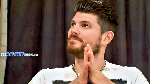 Handsome bearded hunk in white t-shirt during casting interview