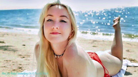 Ann Joy topless nude sunbathing on peaceful sunny beach