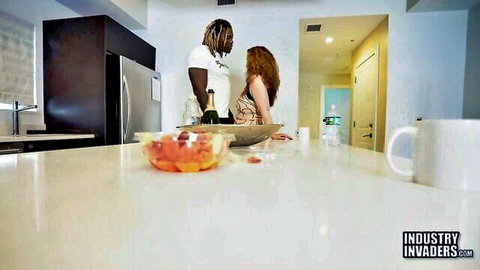 Redhead in lingerie spreads legs on kitchen counter for BBC stud intimate tease