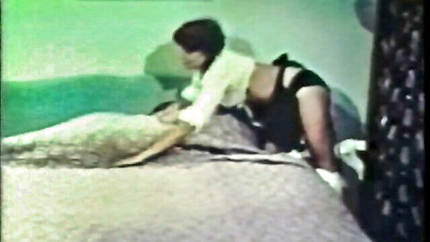 Candy Samples in vintage 1972 porn, busty brunette riding cock on bed