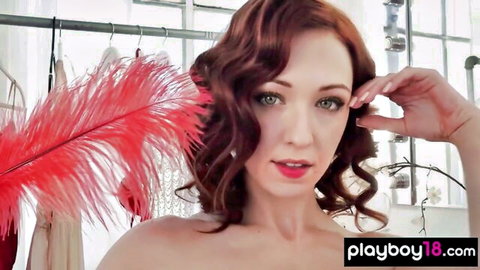 Redhead flexible athlete babe topless with red feathers