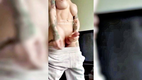 Sara Salazar's tattooed muscular man in gray sweatpants, teasing bulge