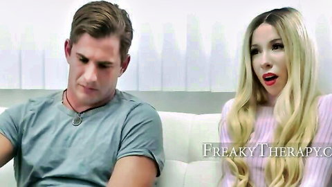 Blonde therapist in pink top talks surprised to handsome patient on couch in Freaky Therapy