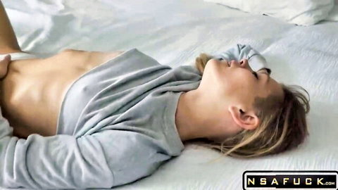 Blonde slutty toy in grey crop top lying on bed, ready for no mercy pussy pounding