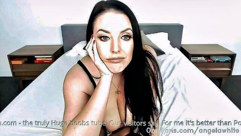 Angela White seductive pose in black lingerie, huge breasts on display
