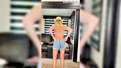 Vicky Stark topless in cowboy hat and denim shorts, butt view try-on