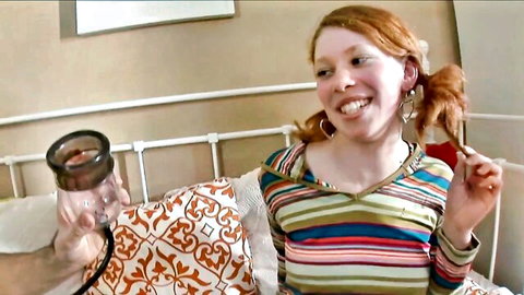 Candy Red redhead teen smiling with cum-filled cup in POV tease