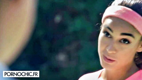 Fit brunette in pink headband and top outdoors tease