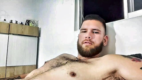 Caballero0314 muscular bearded Latino man shirtless lounging