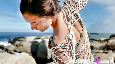 Sofi Ka in torn net lingerie exposing her beautiful ass on beach