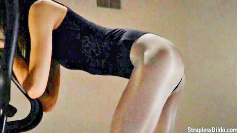 Jane bending over in black bodysuit, showcasing long legs and firm ass