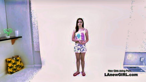 Young Asian teen in tank top and shorts poses for lesbian strapon audition