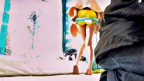 Skinny young Asian bending over flashing tight yellow panties and small ass under short orange skirt