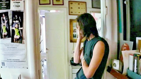 Elena Gigliotti in green tank top, seductive side view nude tease
