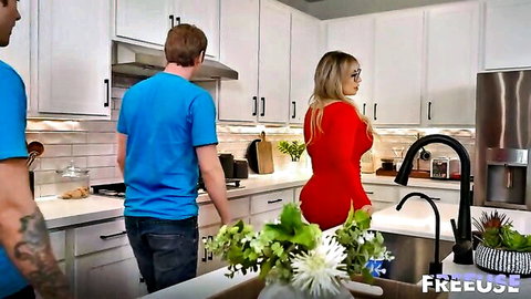 Blonde MILF in tight red dress bends over kitchen counter teasing guys for freeuse fuck