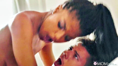Busty black MILF passionately giving oral sex to stud
