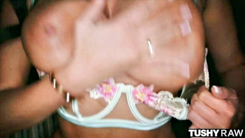 Curvy MILF Anissa Kate in white floral lingerie, teasing cleavage