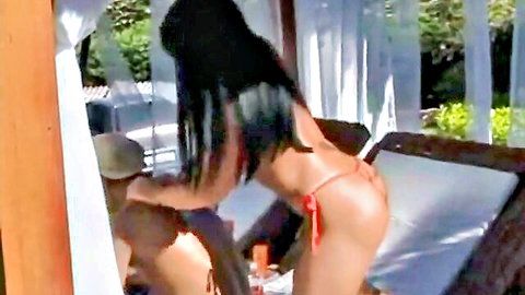 Ebony babe bent over doggy style in red thong with bare ass exposed as guy grabs her hips outdoors