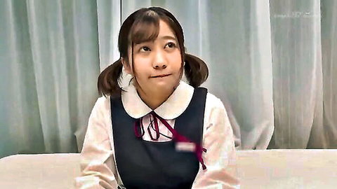 Cute Asian schoolgirl in sailor uniform with pigtails, puzzled expression