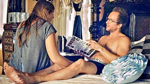 Melissa May in tank top with shirtless daddy on bed, intimate read