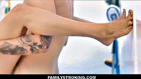 Tanned athletic MILF with rose tattoos spreads legs wide on washing machine exposing pussy