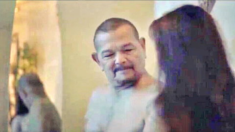 Shirtless bald mustached Filipino man stares hungrily at long-haired Asian woman's bare back in amateur clip