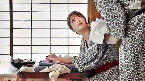 Japanese woman in kimono performing oral on man in traditional attire