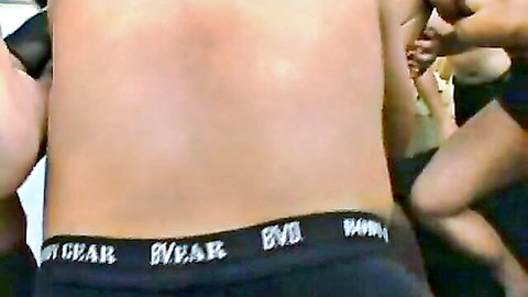 Group of college girls in black underwear at frat house party