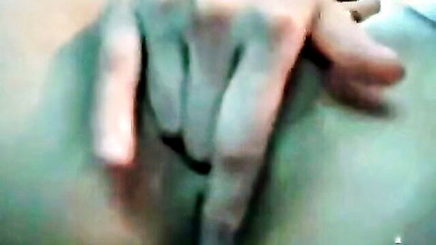 Close-up of Filipina woman fingering her pussy solo
