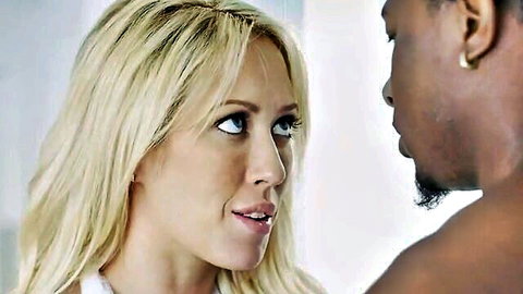 Capri Cavanni blonde wife close-up with black stud, intense eye contact in Bang studio